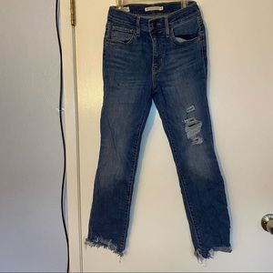 Distressed Woman’s Levi’s 724 high rise straight jeans